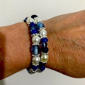 Beautiful memory wire bracelet. Blue glass, pearls, silver accents.